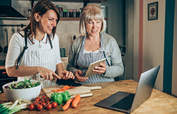 Two family members making a healthy meal